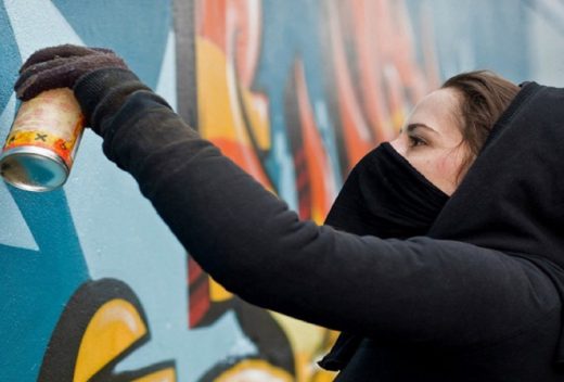 Woman spray painting