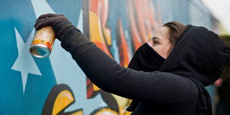 Woman spray painting