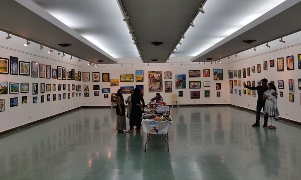 Unidentified People Watching And Taking Selfies At The Grand Art Festival Of Photojournalism 